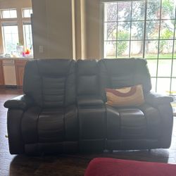 leather sofa in great condition! both reclines and have cup holder and charger in between 