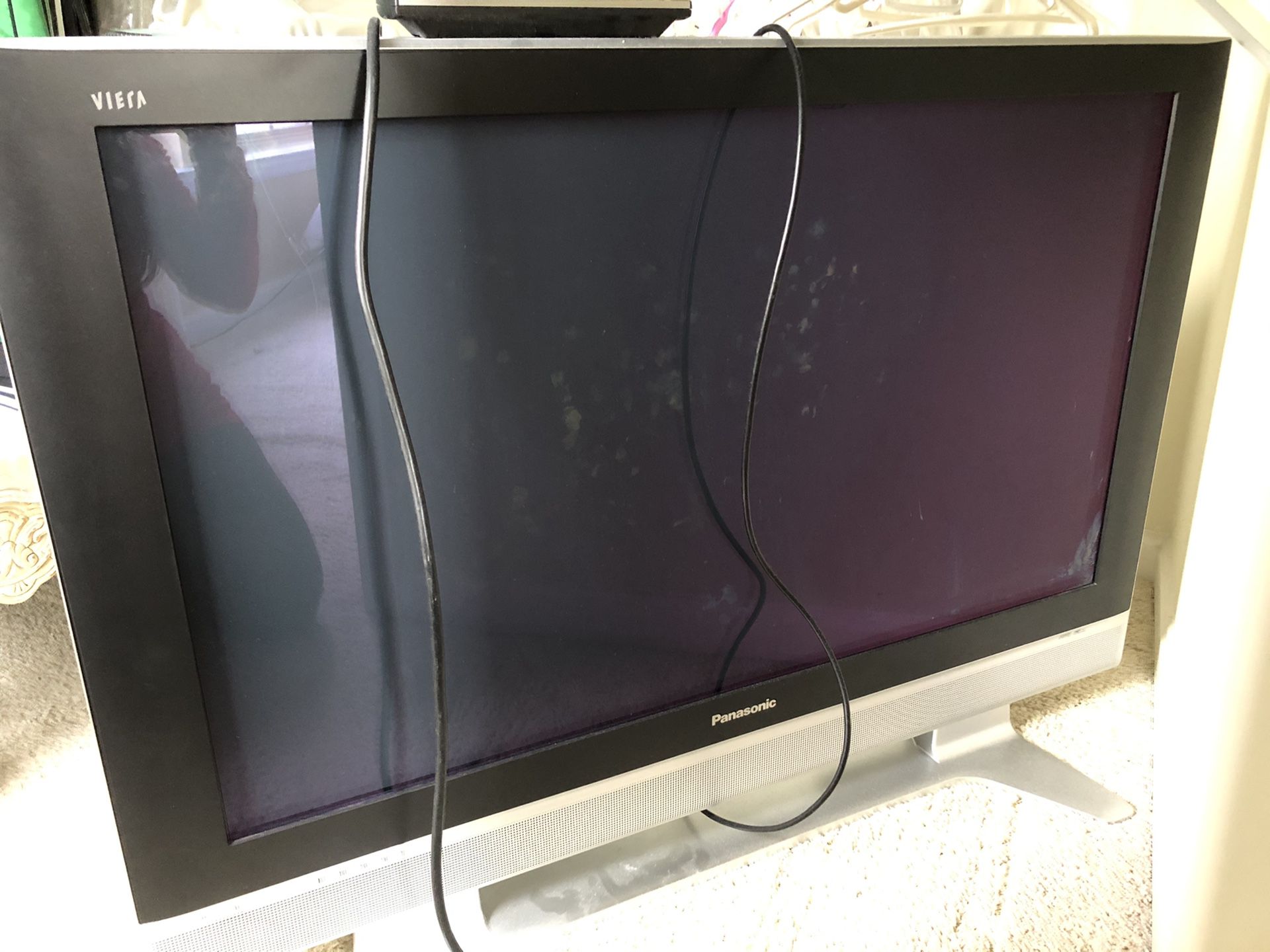 Panasonic 42” High Def Plasma TV on stand & has wall mount brackets installed