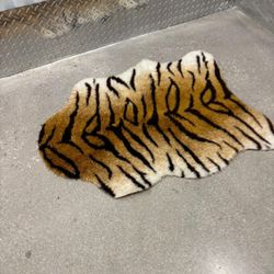 Tiger fluffy floor mat .., 35” x 27” $20