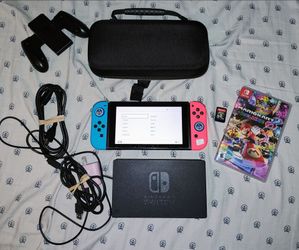Nintendo switch bundle with brand new joycons. 2 games and 64gb Microsd card.