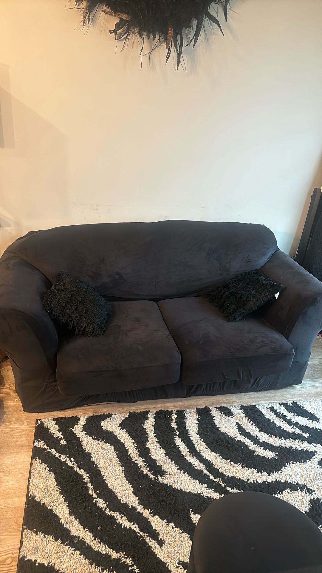 Black Loveseat With Two Pillows