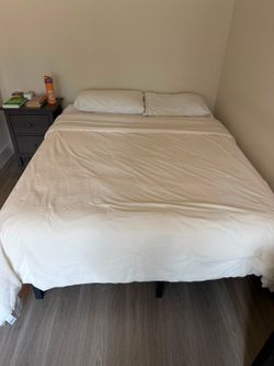 Queen bed w/ mattress, linens and pillows