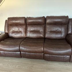 Recliner couch with chargers on the side