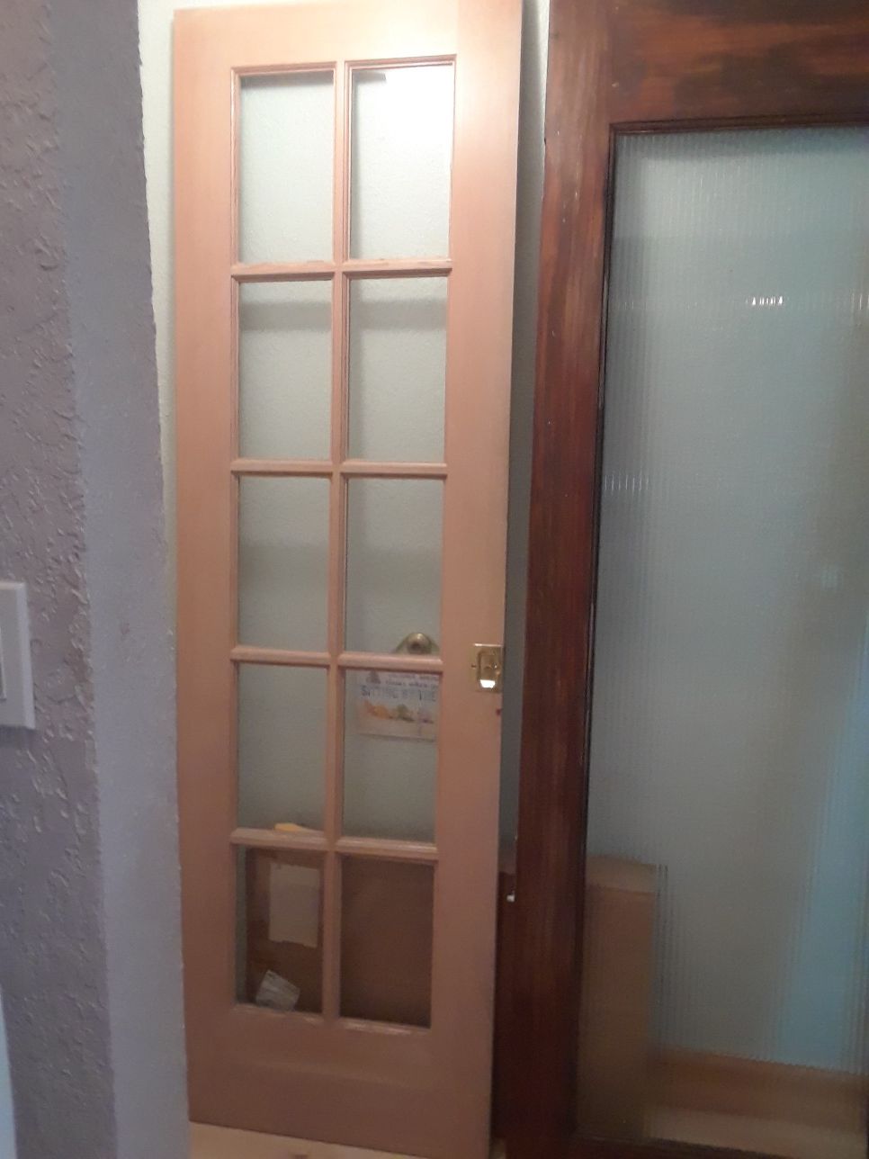 Originally 1/2 of Sliding French Door, 24 x 79.5, plain wood, clear glass panels $50. Sturdy. For pick up. Sliding door brass handle No hinges