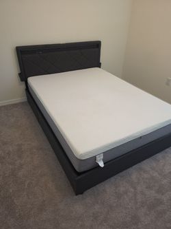 Gray queen size bed with mattress