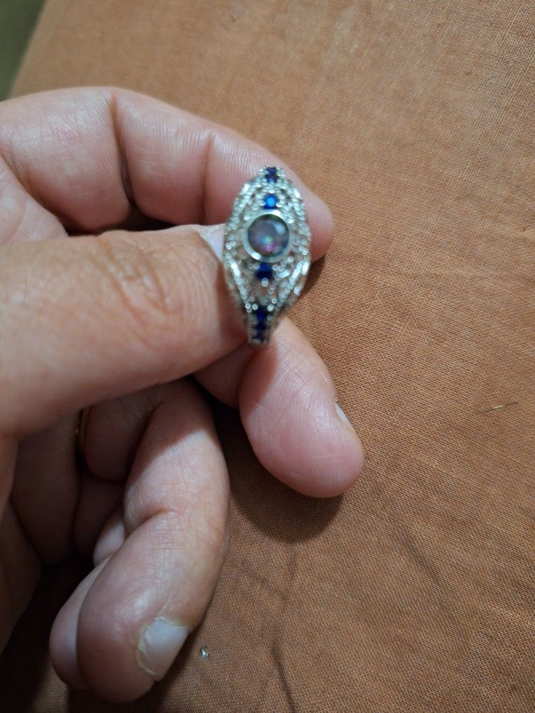 Ring With dark Blue Jem Stones On The Side
