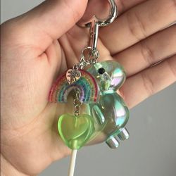 Iridescent green Dinosaur Keychain with Rainbow and candy Charms