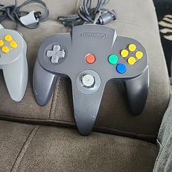 2 Nintendo 64 Controllers And Memory Card 
