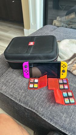 Nintendo Switch with Games and Carrying Case