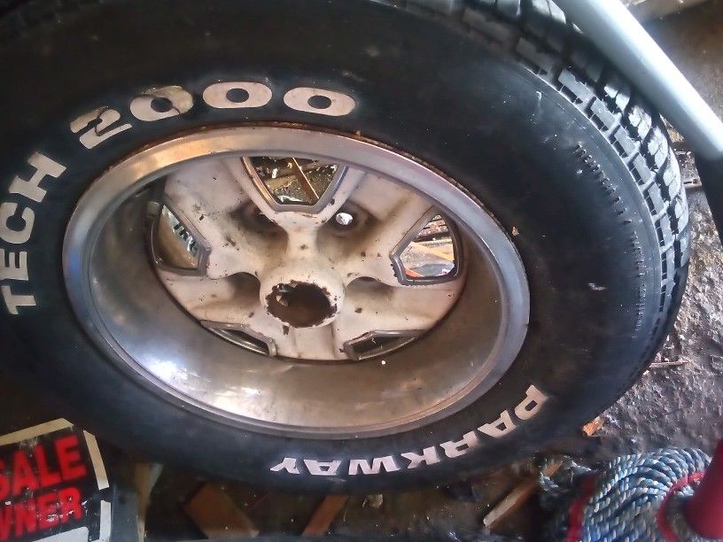 235/60/R14 Tire And 5 Lug Rim.