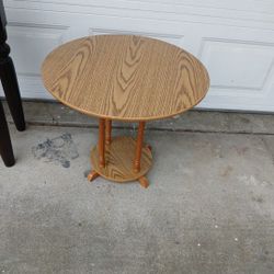 Round Two-Tier Wood Accent Table With An Oak-Look Finish