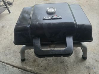 This Char-Broil portable gas grill features a compact, tabletop design perfect for tailgating and camping