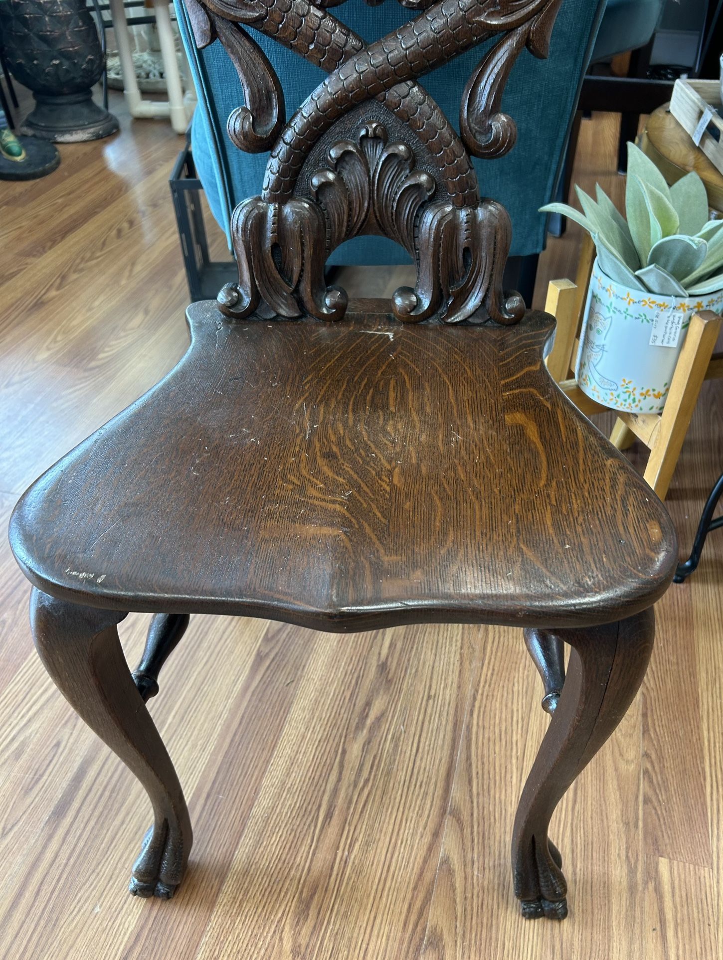 Antique American carved oak wood hall chair, dolphin heads beast