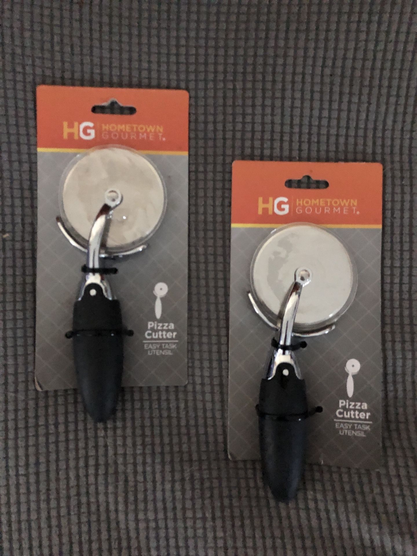 2 new in package hometown gourmet pizza cutters.