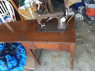 Old sewing maching. Brand starts with e