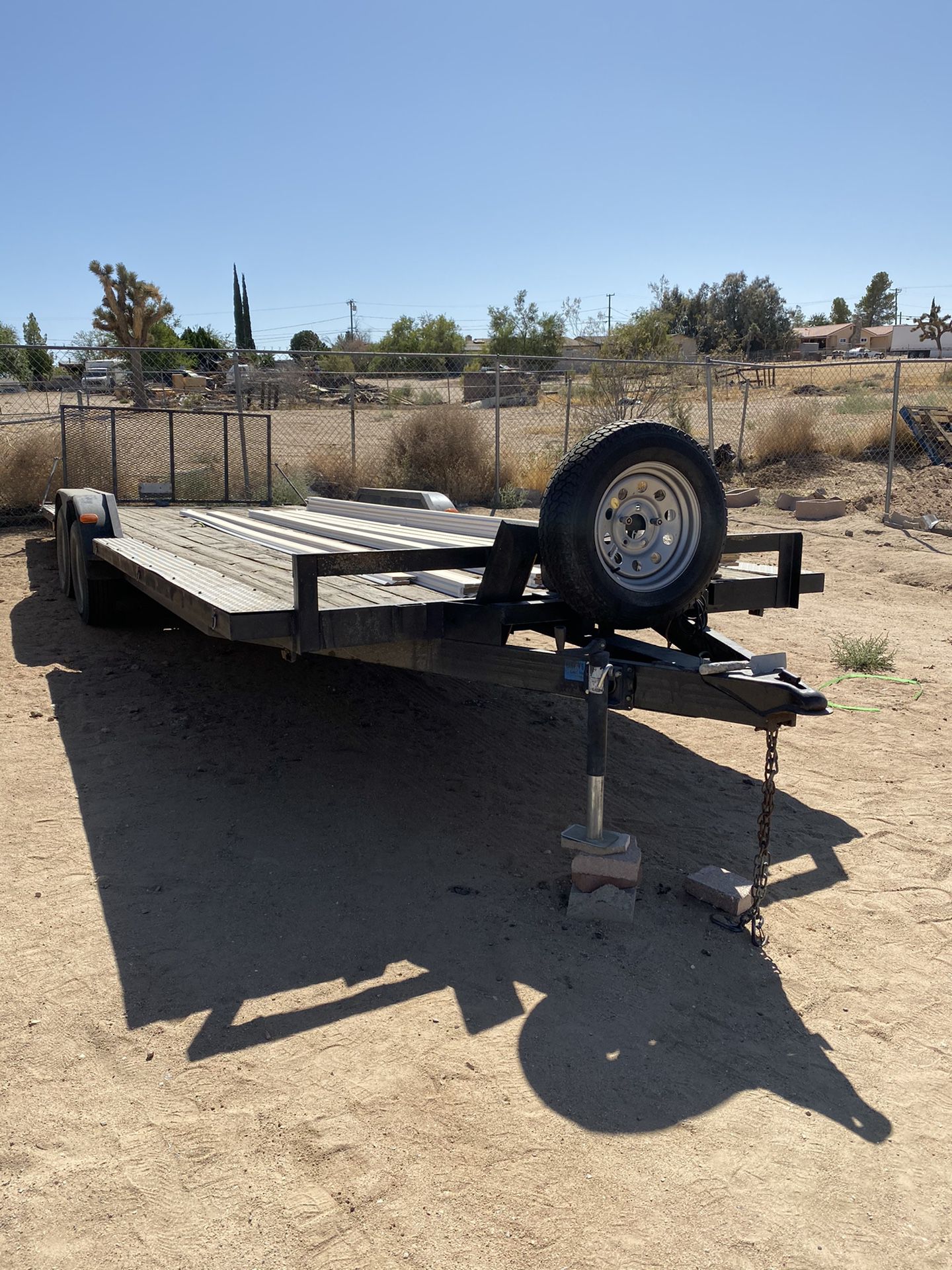 24’ trailer 99” wide with winch and ramp in very good condition 2 spear rims and tires