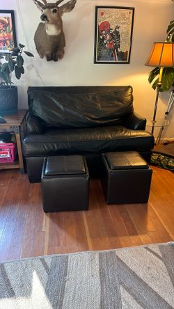Black leather fold out couch bed, twin size with black leather foot Ottomans blanket storage boxes