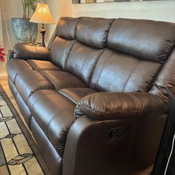 New Reclining Sofa And Love Seat. Faux Leather 
