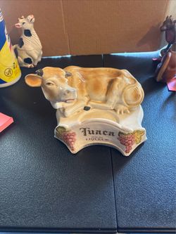 Tuaca Italian liqueur cow display stand