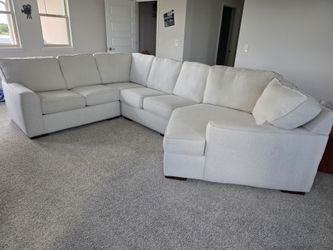 Beautiful Austin White Fabric Large Right Cuddler Sectional purchased from CITY Furniture.
