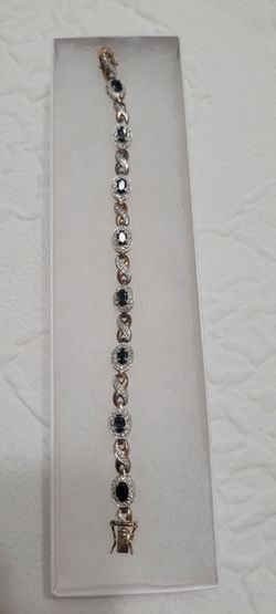 Gold Tone Bracelet with Dark Oval Stones