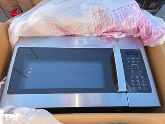 GE  Over The Range Stainless Steel Microwave New (Price Is Firm)