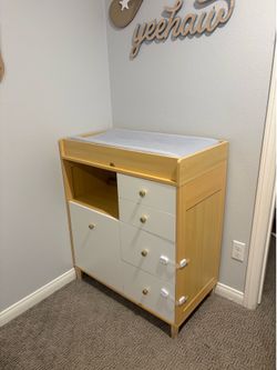 Delta Children changing table with storage