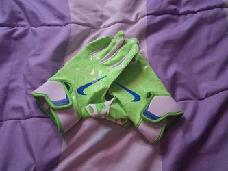 White and green medium football gloves with blue Nike logo
