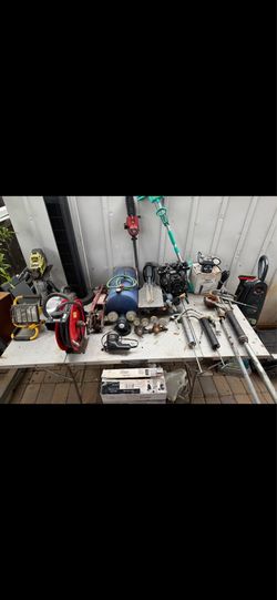 A bunch of tools, fan, carpet washing vacuum, heater