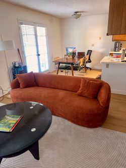 Modern Curved Bouclé Sofa – Burnt Orange | Like New