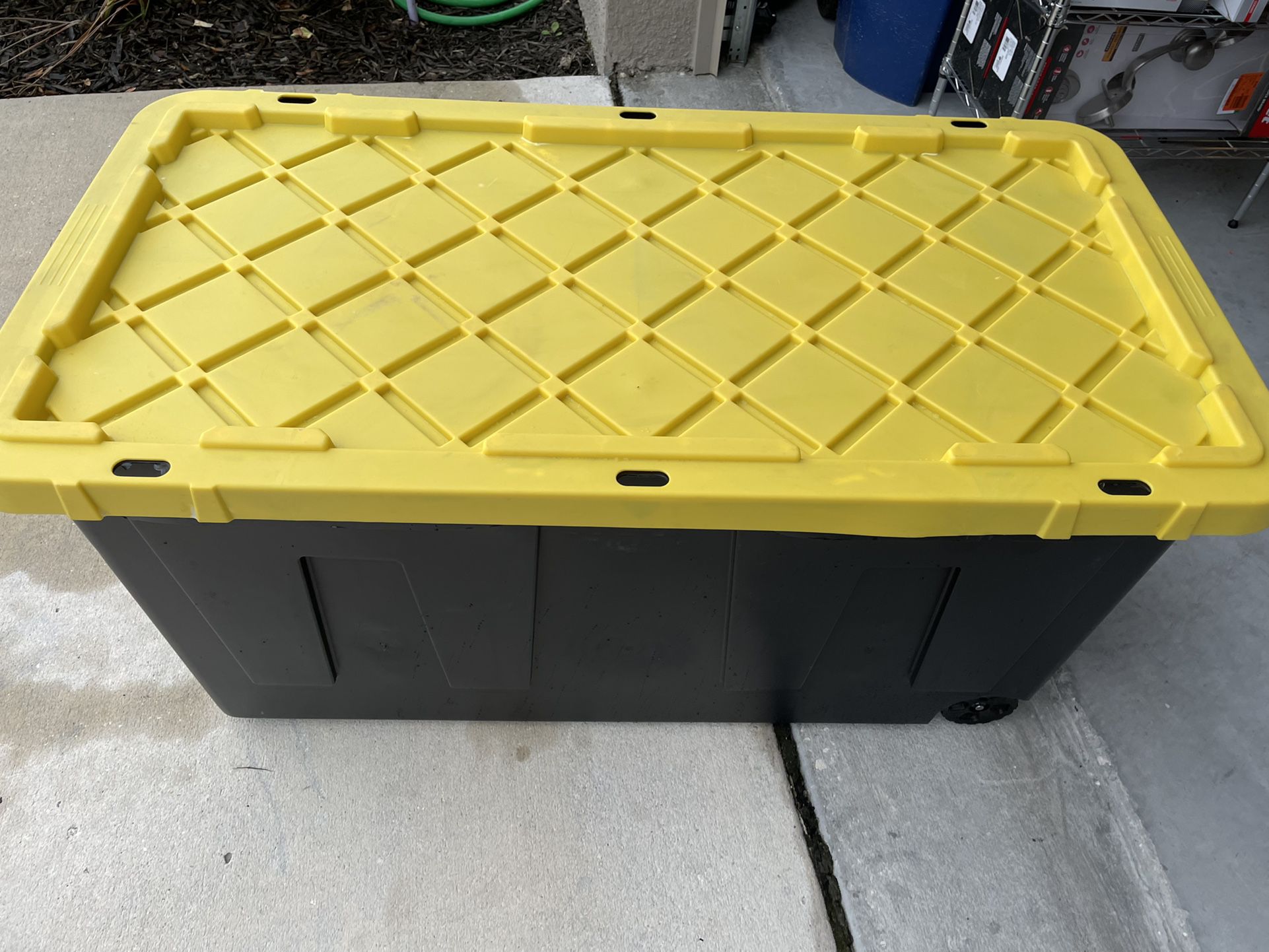 70 Gal. Tough Storage Tote with Wheels in Black with Yellow Lid