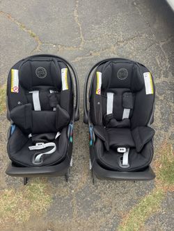 Black Cybex cloud G car seats with load base
