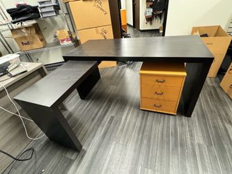 Black L shaped desk with retractable side and file drawer