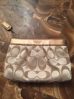 COACH gold wristlet