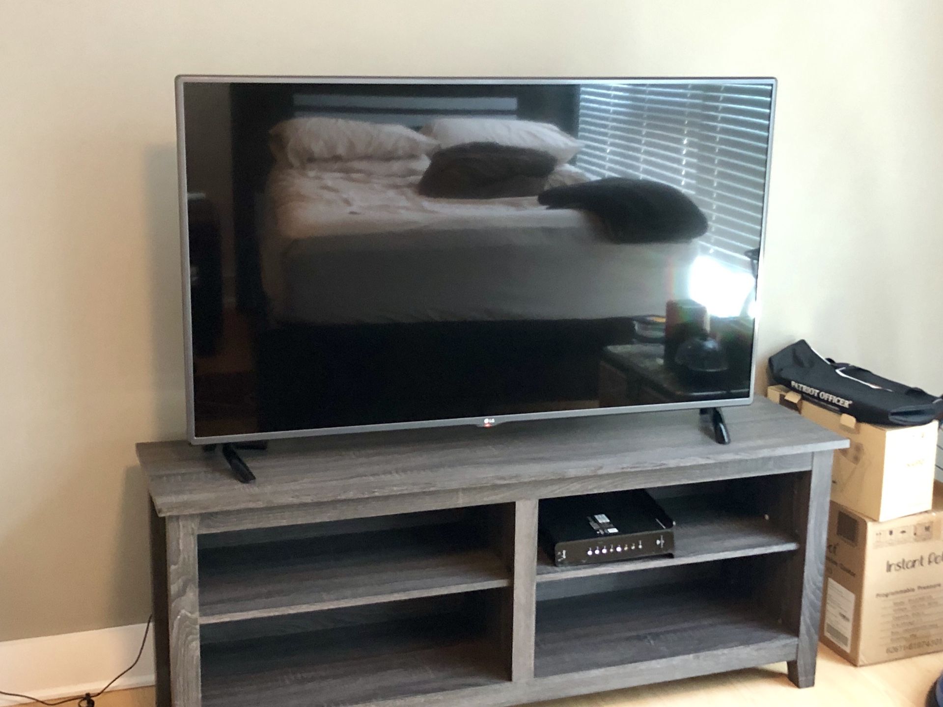 LG 1080P Smart TV (55”) + Rustic Gray TV Stand