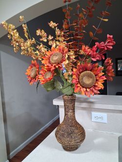 Decorative Floral arrangement with a woven base