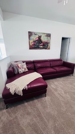 Sofia vergara sofa set with vase and wall art