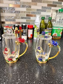 Glass tea cups with stirring spoons