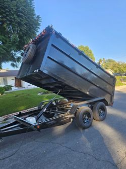 NEW DUMP TRAILER 8X12X4 12000 LBS
ROLLING TARP--SPARE TIRE,ELECTRIC BRAKES,HYDRAULIC SYSTEM,REMOTE CONTROL,IDEAL FOR HAULING, DEMOLITION, TRASH ETC,FO