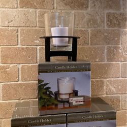 Three iron and glass candleholders.