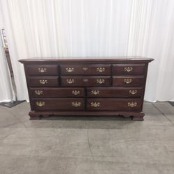 Dark Wood Ten-Drawer Dresser with Brass Pulls