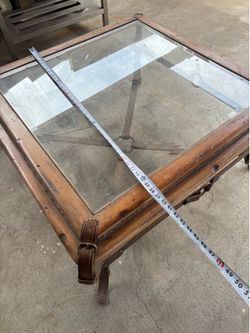 Iron and glass and wood finish coffee table