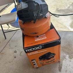 RIDGID 6 Gal. 150 PSI Portable Electric Oil-Free Jobsite Pancake Air Compressor with Dual Pressure Gauges and 2-Quick Couplers
