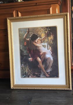 Boy and girl on a swing frame