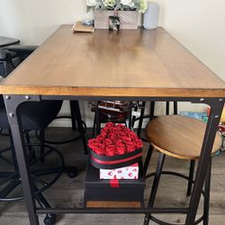 Table With Four Barstools 