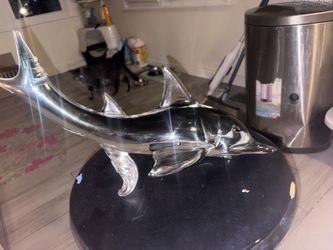 Glass dolphin sculpture