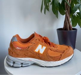 Men Size 11.5 New Balance 2002R Orange Shoes