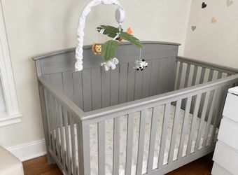 Gray baby crib