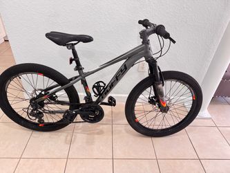 Bicycle Huffy Scout. Disc brake , rim 24”.need a little adjust the rear brake . Good tires good condition.