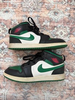 Jordan 1 Mid Green Thunder sneakers with black, white, and green color blocking